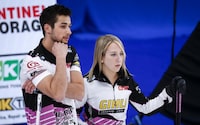 Team Sahaidak/Lott skip Kadriana Sahaidak, right, and third Colton Lott discuss strategy while playing Team Einarson/Gushue during the Canadian Mixed Doubles Curling Championship final in Calgary, Alta., Thursday, March 25, 2021.THE CANADIAN PRESS/Jeff McIntosh