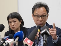 Sen. Yuen Pau Woo denounces RCMP allegations of Chinese government interference in Canada as community organizer May Chiu looks on during a news conference at the Service à la Famille Chinoise du Grand Montreal, Friday, May 5, 2023, in Montreal. THE CANADIAN PRESS/Ryan Remiorz