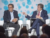 Toronto Mayor John Tory, right, and Gil Penalosa, founder and chair of 8 80 Cities, take part in a panel discussion at the XII Metropolis World Congress on Tuesday, June 20, 2017 in Montreal. THE CANADIAN PRESS/Ryan Remiorz
