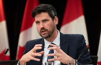 Minister of Housing, Infrastructure and Communities Sean Fraser responds to a question during a news conference, in Ottawa, Tuesday, Dec. 5, 2023. Fraser says Canadians can expect to see a full plan from the federal government in 2024 that lays out how it will tackle the housing crisis.THE CANADIAN PRESS/Adrian Wyld