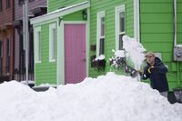 A person shovels snow in Halifax on Monday, February 5, 2024.&nbsp;Cleanup in Nova Scotia could take days after more than a metre of snow piled up in some parts of the province over the weekend. THE CANADIAN PRESS/Darren Calabrese
