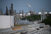 Refinery facilities are seen beyond a railroad yard by the Houston Ship Channel in Houston, Texas, U.S., May 5, 2019.  REUTERS/Loren Elliott