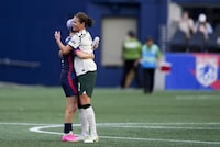 OL Reign forward Megan Rapinoe, left, hugs Portland Thorns midfielder Christine Sinclair at the conclusion of an NWSL soccer match, Saturday, June 3, 2023, in Seattle. (AP Photo/Lindsey Wasson)