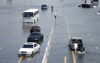 DUBAI, UNITED ARAB EMIRATES - APRIL 18: Abandoned vehicles on a flooded highway can be seen on April 18, 2024 in Dubai, United Arab Emirates. Atypically heavy rains in the UAE on Monday and Tuesday caused flooding, flight cancellations, and school closures. UAE authorities have denied that their cloud-seeding operations were to blame for the extreme rainfall. (Photo by Francois Nel/Getty Images)