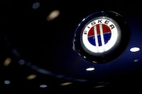 FILE PHOTO: The logo of Fisker Automotive is pictured on a car at the 2022 Paris Auto Show in Paris, France, October 18, 2022. REUTERS/Stephane Mahe/File Photo