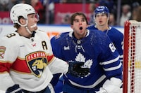 Toronto Maple Leafs goaltender Joseph Woll (60) reacts after losing his mask from Florida Panthers left wing Matthew Tkachuk (19) crashing into him during third period NHL hockey action in Toronto on Tuesday, Nov. 28, 2023. THE CANADIAN PRESS/Frank Gunn

