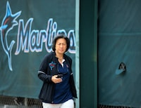 FILE - Miami Marlins General Manager Kim Ng looks on during the team's spring training baseball workout at Roger Dean Stadium on Tuesday, March 15, 2022 in Jupiter, Fla. Kim Ng is leaving the Miami Marlins after three seasons as their general manager, Marlins chairman and principal owner Bruce Sherman said Monday, Oct. 16, 2023. (David Santiago/Miami Herald via AP, File)