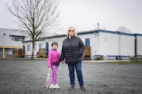 Alannah Sheriland, a mother of two school-aged children in Surrey, British Columbia, is photographed with her first grader outside of the portables at Hazelgrove Elementary School on January 5, 2024. (Jennifer Gauthier/The Globe and Mail)

