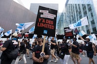 Quebec health-care workers and members from the Quebec’s nurses union (FIQ) demonstrate to demand a new contract negotiation in Montreal, Wednesday, Sept. 6, 2023. THE CANADIAN PRESS/Christinne Muschi