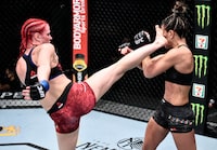 June 20, 2020; Las Vegas, NV, USA; Gillian Robertson kicks Cortney Casey in their flyweight bout during UFC Fight Night at UFC APEX. Mandatory Credit: Chris Unger/Zuffa LLC via USA TODAY Sports