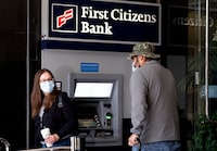 Customers leave a First Citizens Bank branch location in the Encino section of Los Angeles on Monday, March 27, 2023. North Carolina-based First Citizens is to buy Silicon Valley Bank, the tech industry-focused financial institution that collapsed earlier this month. (AP Photo/Richard Vogel)