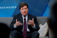 FILE PHOTO: Fox personality Tucker Carlson speaks at the 2017 Business Insider Ignition: Future of Media conference in New York, U.S., November 30, 2017.  REUTERS/Lucas Jackson/File Photo