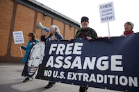 Activists marking five years since the arrest of Wikileaks founder Julian Assange demonstrate outside Belmarsh Prison in London, Sunday, April 14, 2024. U.S. President Joe Biden said last week that he is considering a request from Australia to drop the decade-long U.S. push to prosecute Assange for publishing a trove of American classified documents. Assange is currently fighting extradition to the U.S. from Belmarsh, where he is being held. (AP Photo/David Cliff)