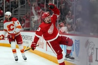 Detroit Red Wings right wing Alex DeBrincat (93) celebrates his goal against the Calgary Flames in the third period of an NHL hockey game Sunday, Oct. 22, 2023, in Detroit. (AP Photo/Paul Sancya)