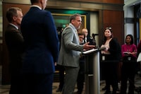 Minister of Health Mark Holland speaks to reporters in the foyer of the House of Commons on Parliament Hill in Ottawa on Wednesday, Jan. 31, 2024. THE CANADIAN PRESS/Sean Kilpatrick
