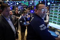 Traders work on the floor at the New York Stock Exchange (NYSE) in New York City, U.S., February 29.