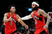 Toronto Raptors forward Scottie Barnes (4) and guard Gary Trent Jr. (33) celebrate a basket against the Miami Heat during second half NBA basketball action in Toronto on Wednesday, Jan. 17, 2024. THE CANADIAN PRESS/Frank Gunn