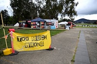 A ‘No’ sign sits in front of the Tent Embassy near the Old Australian Parliament House as voters arrive during The Voice referendum, in Canberra, Australia, October 14, 2023. REUTERS/Tracey Nearmy