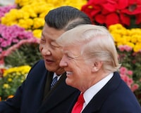 FILE – Then-U.S. President Donald Trump, right, chats with Chinese President Xi Jinping during a welcome ceremony at the Great Hall of the People in Beijing, Thursday, Nov. 9, 2017. As chances rise of a Joe Biden-Trump rematch in the U.S. presidential election race, America’s allies are bracing for a bumpy ride. Trump has derided the leaders of some friendly nations, while he has called Xi “brilliant.” (AP Photo/Andy Wong, File)