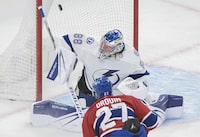 Montreal Canadiens' Jonathan Drouin (27) scores against Tampa Bay Lightning goaltender Andrei Vasilevskiy during first period NHL hockey action in Montreal, Tuesday, March 21, 2023. THE CANADIAN PRESS/Graham Hughes