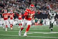 Kansas City Chiefs quarterback Patrick Mahomes (15) runs for a first down against the New York Jets during the fourth quarter of an NFL football game, Sunday, Oct. 1, 2023, in East Rutherford, N.J. (AP Photo/Adam Hunger)