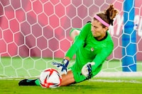 Canada's Stephanie Labbe makes a save against Sweden in the sixth round of the penalty shoot-out in the women's soccer final during the summer Tokyo Olympics in Yokohama, Japan on Friday, August 6, 2021. THE CANADIAN PRESS/Frank Gunn