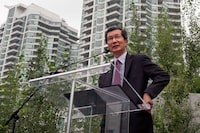 Former Ontario cabinet minister Michael Chan is suing the Canadian Security Intelligence Service and unidentified employees who he says leaked classified information with the intent of harming his reputation. Chan speaks about Toronto Pan Am/Parapan Am Games on August 28, 2013. THE CANADIAN PRESS/Galit Rodan