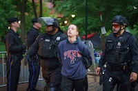 Police detain a protester on the University of Pennsylvania campus, in Philadelphia, on Friday, May 10, 2024.  (Jessica Griffin/The Philadelphia Inquirer via AP)