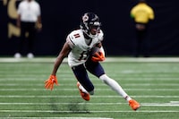 Chicago Bears wide receiver Darnell Mooney carries the ball during the second half of an NFL football game against the New Orleans Saints Sunday, Nov. 5, 2023, in New Orleans. (AP Photo/Butch Dill)