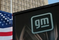 FILE PHOTO: The new GM logo is seen on the facade of the General Motors headquarters in Detroit, Michigan, U.S., March 16, 2021. Picture taken March 16, 2021.  REUTERS/Rebecca Cook/File Photo