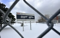 A sign for a Canadian Forces base is seen in Montreal, Monday, Jan. 15, 2024. The national spy watchdog is calling on the military's counter-intelligence unit to suspend investigative searches of a workplace computer system over concerns about employee privacy. THE CANADIAN PRESS/Christinne Muschi