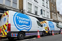 Thames Water vans are parked on a road as repair and maintenance work takes place, in London, Britain, April 3, 2024. REUTERS/Toby Melville/File Photo