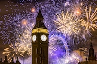 LONDON, ENGLAND - JANUARY 1: Fireworks light up the London skyline over Big Ben and the London Eye just after midnight on January 1, 2023 in London, England. London's New Years' Eve firework display returned this year after it was cancelled during the Covid Pandemic. (Photo by Dan Kitwood/Getty Images) *** YEAR IN REVIEW - NEWS ***
