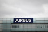 FILE PHOTO: A logo of Airbus is seen at the entrance of its factory in Blagnac near Toulouse, France, July 2, 2020.  REUTERS/Benoit Tessier/File Photo
