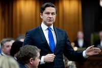 Pierre Poilievre rises during question period on Parliament Hill in Ottawa, on Wednesday, March 20, 2024. A spokesman for a regional Muslim advocacy group says the Conservative leader's stance on the Israel-Hamas war could complicate his party's relationship with Muslim Canadians. THE CANADIAN PRESS/Spencer Colby