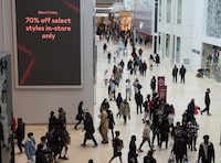 People navigate through Yorkdale Mall in search of Black Friday sales in Toronto on Friday, Nov. 26, 2021. In-store shopping to make comeback this Black Friday as holiday budgets shrink.THE CANADIAN PRESS/Tijana Martin
