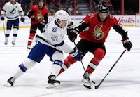 Tampa Bay Lightning centre Mitchell Stephens (67) tries to keep the puck from Ottawa Senators defenceman Cody Goloubef (29) during first period NHL hockey action in Ottawa, Saturday, Jan. 4, 2020. THE CANADIAN PRESS/Justin Tang