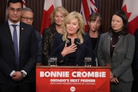 Ontario Liberal Leader Bonnie Crombie says if she is premier after the 2026 election, she will not introduce a provincial carbon tax. Crombie stands with  Ontario Liberal caucus members as she talks to the media at the Queens Park Legislature  in Toronto on Tuesday, December 5, 2023. THE CANADIAN PRESS/Chris Young