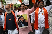 A member of United Hindu Front organisation shouts slogans while holding a banner depicting Gurpatwant Singh Pannun, a lawyer believed to be based in Canada designated as a Khalistani terrorist by the Indian authorities during a rally along a street in New Delhi on September 24, 2023. In an interview with an Indian news channel, Pannun said Nijjar had been his "close associate" for over 20 years and was like a "younger brother" to him. He also blamed India for Nijjar's killing. A diplomatic firestorm erupted this week with Canadian Prime Minister Justin Trudeau saying there were "credible reasons to believe that agents of the government of India were involved" in Nijjar's death. (Photo by Arun SANKAR / AFP) (Photo by ARUN SANKAR/AFP via Getty Images)
