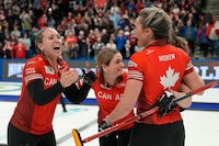 Canada skip Rachel Homan, left, celebrates with teammates Tracy Fleury, Sarah Wilkes and Emma Miskew after defeating Switzerland's Silvana Tirinzoni rink at the World Women's Curling Championship gold medal game in Sydney, N.S. on Sunday, March 24, 2024. THE CANADIAN PRESS/Frank Gunn



