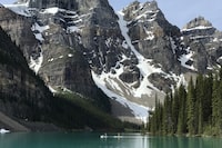 Moraine Lake in Banff National Park is shown in Lake Louise, Alta., in June 2020. Parks Canada says its new online reservation system to book camping sites and other activities at national parks appears to have worked well during its first week of operations. THE CANADIAN PRESS/Jonathan Hayward