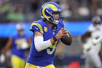 INGLEWOOD, CALIFORNIA - NOVEMBER 19: Quarterback Matthew Stafford #9 of the Los Angeles Rams looks to pass the ball during the first half of a game against the Seattle Seahawks at SoFi Stadium on November 19, 2023 in Inglewood, California. (Photo by Sean M. Haffey/Getty Images)
