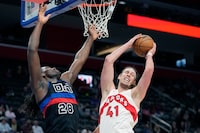 Toronto Raptors forward Kelly Olynyk (41) pulls down a rebound next to Detroit Pistons center Isaiah Stewart (28) during the second half of an NBA basketball game, Wednesday, March 13, 2024, in Detroit. (AP Photo/Carlos Osorio)