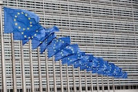 FILE PHOTO: European Union flags flutter outside the EU Commission headquarters in Brussels, Belgium, July 14, 2021. REUTERS/Yves Herman/File Photo