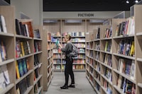 People browse books at an Indigo store in Toronto, on Friday, September 23, 2022. (Christopher Katsarov/The Globe and Mail)