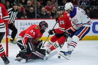 Chicago Blackhawks goaltender Petr Mrazek makes a save against Edmonton Oilers left wing Evander Kane during the first period of an NHL hockey game Tuesday, Jan. 9, 2024, in Chicago. (AP Photo/Erin Hooley)