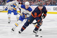 Mar 21, 2024; Edmonton, Alberta, CAN; Buffalo Sabres defensemen Bowen Byron (4) chases Edmonton Oilers forward Zach Hyman (18) up the ice during the third period at Rogers Place. Mandatory Credit: Perry Nelson-USA TODAY Sports