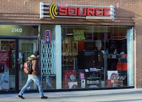 A man walks past The Source store in Toronto on Monday, March 2, 2009. THE CANADIAN PRESS/Frank Gunn