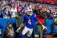 Buffalo Bills running back James Cook (4) scores a touchdown and celebrates against the Dallas Cowboys in an NFL football game, Sunday, Dec. 17, 2023, in Orchard Park, NY. (AP Photo/Jeff Lewis)