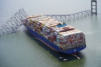 Aerial view of the Dali cargo vessel which crashed into the Francis Scott Key Bridge, causing it to collapse in Baltimore, Maryland, U.S., March 26, 2024. Maryland National Guard/Handout via REUTERS